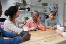 Senior African American Woman Being Supported By A Counsellor In A Support Group