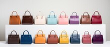 Several Different Colors Of Handbags Are Lined Up Against A White Backdrop
