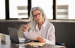 © Prostock-studio - Manager Woman Reading Candidate CV, Holding Paper In Modern Office