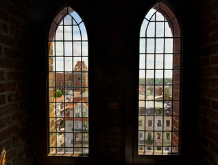 Wall Mural - View through the tall gothic windows of the town hall tower on the old town of Torun, Poland