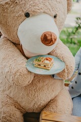 Wall Mural - a teddy bear sitting in the back with a plate of waffles