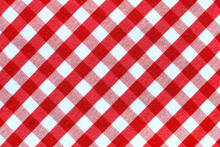 The Texture Of Linen Fabric In A Large Cell Of Red And White. Scottish Tailoring Material. Checkered Fabric