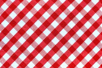 the texture of linen fabric in a large cell of red and white. scottish tailoring material. checkered