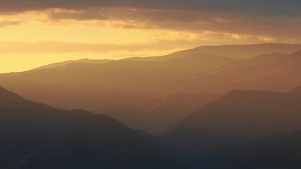 Canvas Print - Golden sunset shining over the big mountains and forests