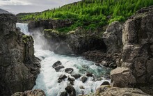 Beautiful Shot Of A Picturesque Rocky Waterfall Leading To A Stream In The East Fjords, Iceland