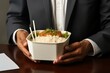 male office worker in white shirt eating for lunch Trendy dish poke bowl with rice or quinoa and salmon in a packaging to go. Take-away meal in the lunch break. Generative AI technology