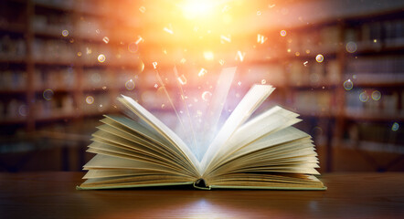 Wall Mural - Book With Magic Lights And Bright Letters In Defocused Modern Library