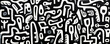 © Saulo Studio - Black and white graffiti pattern texture background with a lot of black and white lettering.