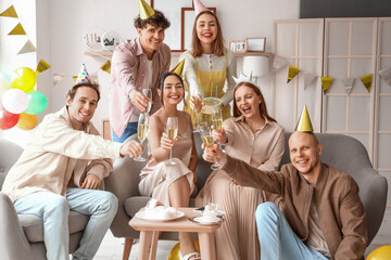 Canvas Print - Group of young friends with champagne celebrating Birthday at home