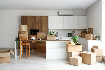 Wall Mural - Counters with cardboard boxes in kitchen on moving day