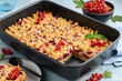 Red currant crumb squares bars. Berry summer pie in ceramic form. Selective focus