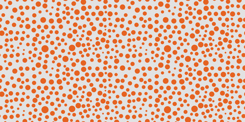 Poster - Surface of orange dots of different sizes. Seamless pattern print for textiles, pillows, clothes, background, packaging, notepads.