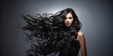Young woman with healthy long black hair. Glossy wavy beautiful hair. Hair salon banner