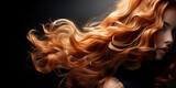 Fototapeta  - Beautiful girl with long red hair on dark background. Glossy wavy beautiful hair