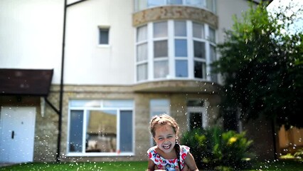 Poster - Dad throwing his happy daughter in the air in the pool. Slow motion