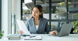 © Orathai - Asian businesswomen sit at their desks and calculate financial graphs showing results about their investments, planning successful business growth process