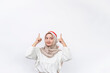 Happy young Asian muslim woman celebrate Indonesian independence day showing thumb up gesture isolated on white background. Indonesian independence day concept