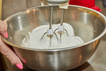 Poster - Chef whips the egg whites with mixer in bowl