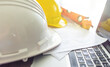 © TWEESAK - Safety helmets and equipment on the engineer's desk