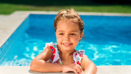 Wall Mural - Smiling girl in the pool