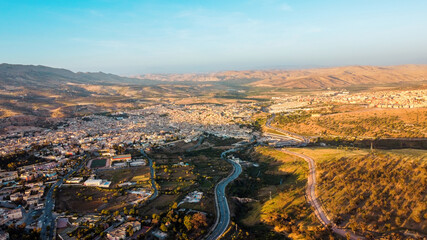 Wall Mural - Aerial drone view of Fes at sunset, Morocco