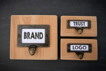 Wall Mural - Brand Trust Logo Concept. File cabinet label. Dark gray background