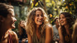 © Nataliya - A group of friends laughing and smiling together during a joyous outdoor gathering