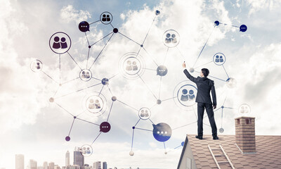 Wall Mural - businessman on house roof presenting networking and connection c