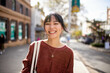 © Austockphoto - Young adult asian woman exploring the inner west urban streets of Sydney