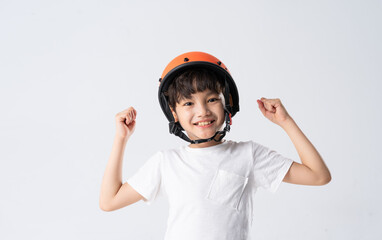 Poster - portrait of asian boy wearing orange helmet on white background