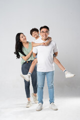 Wall Mural - a family posing on a white background