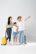 © Q88 - a family posing on a white background