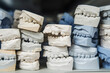 Warehouse of plaster models of human jaws in an orthodontic clinic. Control and diagnostic dental casts for aligners.