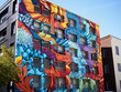 canvas print picture - A shot of a colorful graffiti mural on a city building