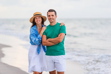 Poster - Young couple on white beach during summer vacation.