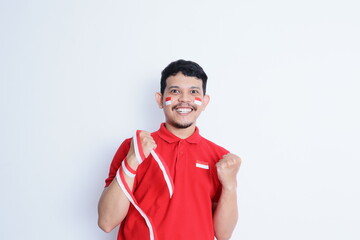 Indonesian man clenched both fist showing excitement when celebrating independence day