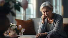 Elderly Frustrated Woman Crying While Sitting On The Couch