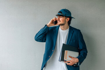 Canvas Print - attractive student talking on mobile phone in the street