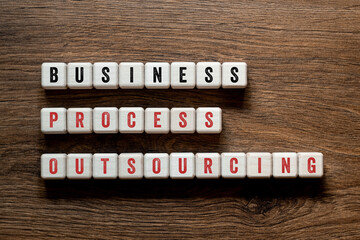 Business process outsourcing - word concept on building blocks, text