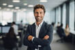 © Moritz - Leader in Innovation: High-Resolution Portrait of a Young Tech CEO Standing in a Bustling Office