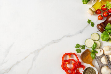 Canvas Print - Food cooking ingredients background with fresh vegetables, herbs, spices and olive oil on white stone table with copy space top view. Healthy vegetarian eating