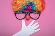 Funny Party concept surprised  face formed with gloves. Rainbow Clown Wig Set with glasses and red clown nose like a face, Fluffy Afro Synthetic Cosplay Anime Fancy Wigs Festive Background