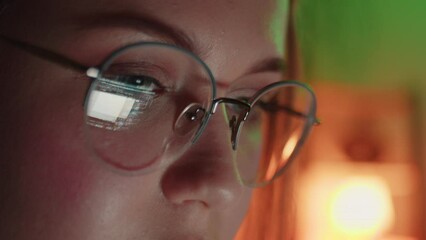 Closeup of Young Adult Women Wearing Reflective Eye Glasses Analyzing Cyber Security Code Data Working Night Concentrating Computer Screen Financial Virus Hacker Female Dark Programmer Crypto BTC 4K