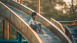 Indian kid sitting alone at playground, sad kid lonely sitting with his arm crossed on the playground