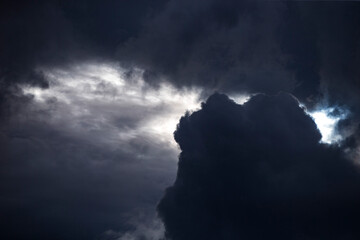 Wall Mural - Stormy sky with white clouds and sun beams. Cloudscape.