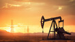 © tashechka - Crude oil pumpjack rig on desert silhouette in evening sunset