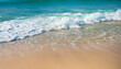 © Uuganbayar - Beautiful tropical wave of summer sea surf. Soft turquoise blue ocean wave on the golden sandy beach