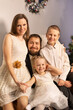 © Evgenia Tiplyashina - christmas family near christmas tree