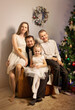 © Evgenia Tiplyashina - christmas family near christmas tree
