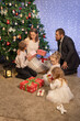 © Evgenia Tiplyashina - christmas family near christmas tree